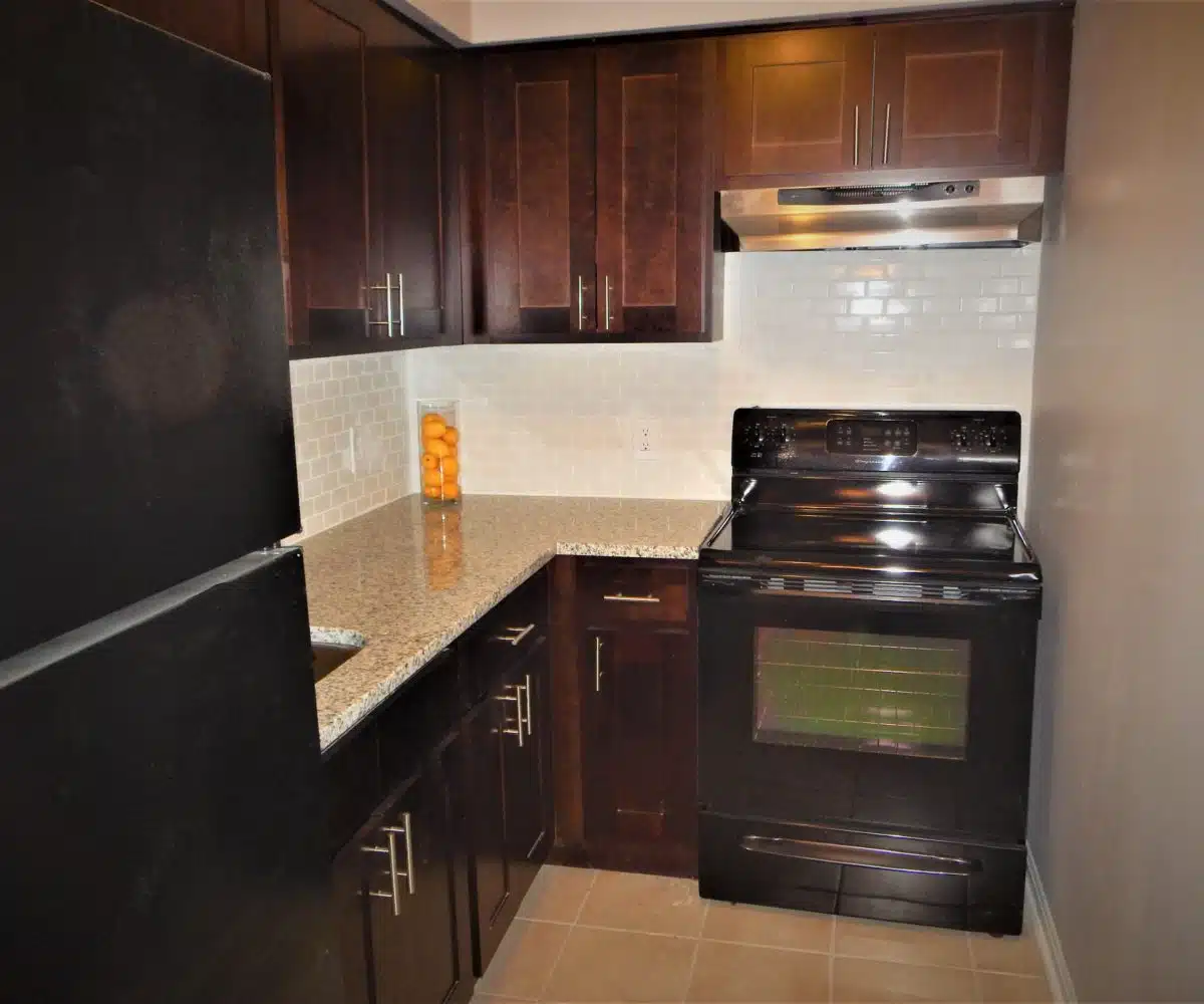Roslyn Kitchen with Granite Counters and Black Oven.