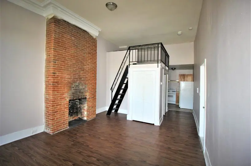 Brick Fireplace in Living Room at 1808 Mcculloh C1F.