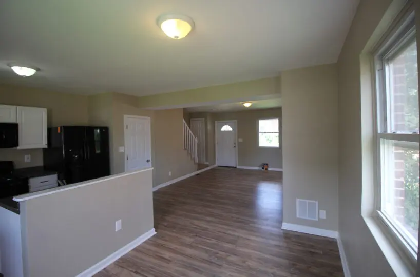 Living Room and Kitchen with View of Front Door.