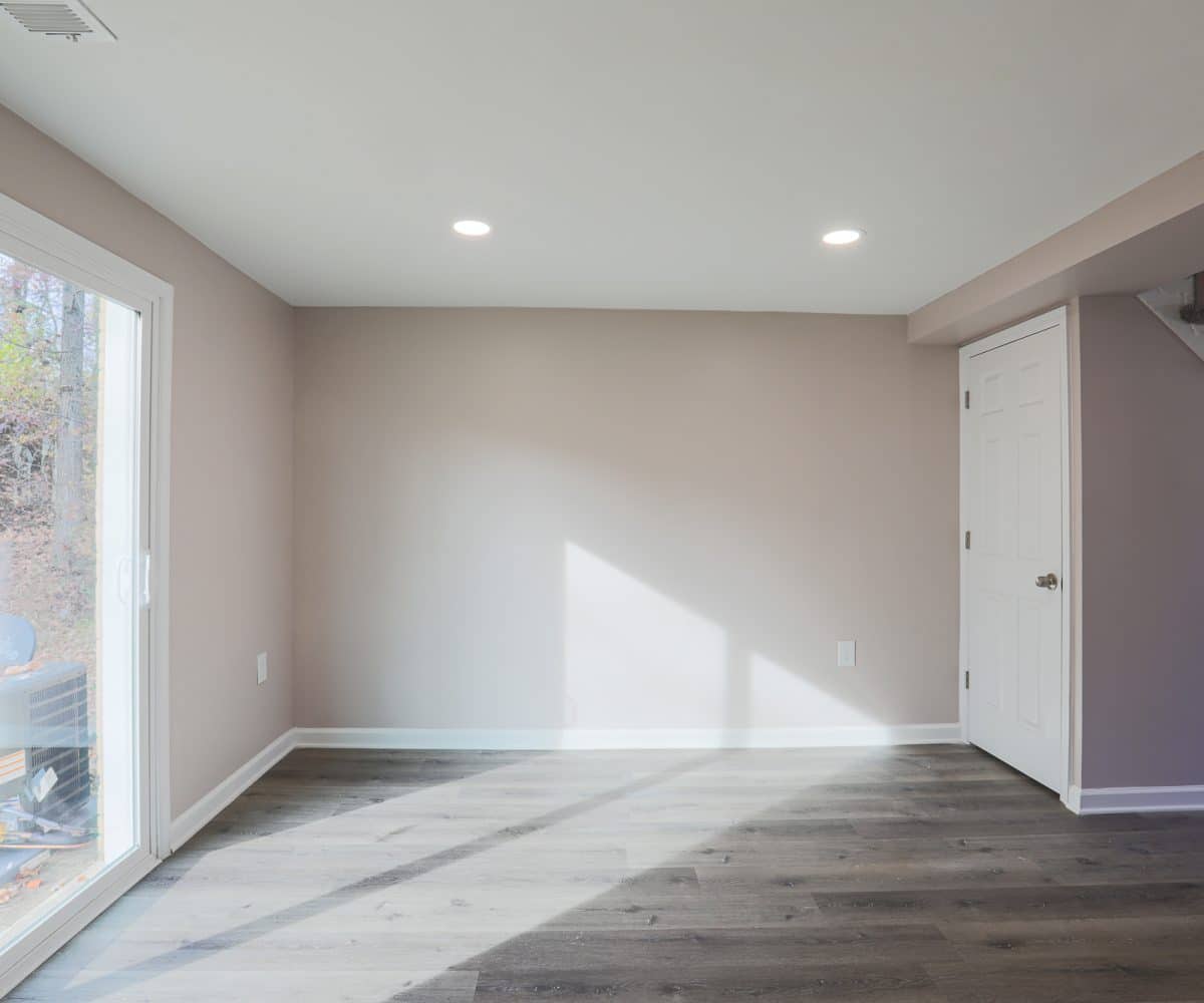Living room with sliding door and view of backyard.