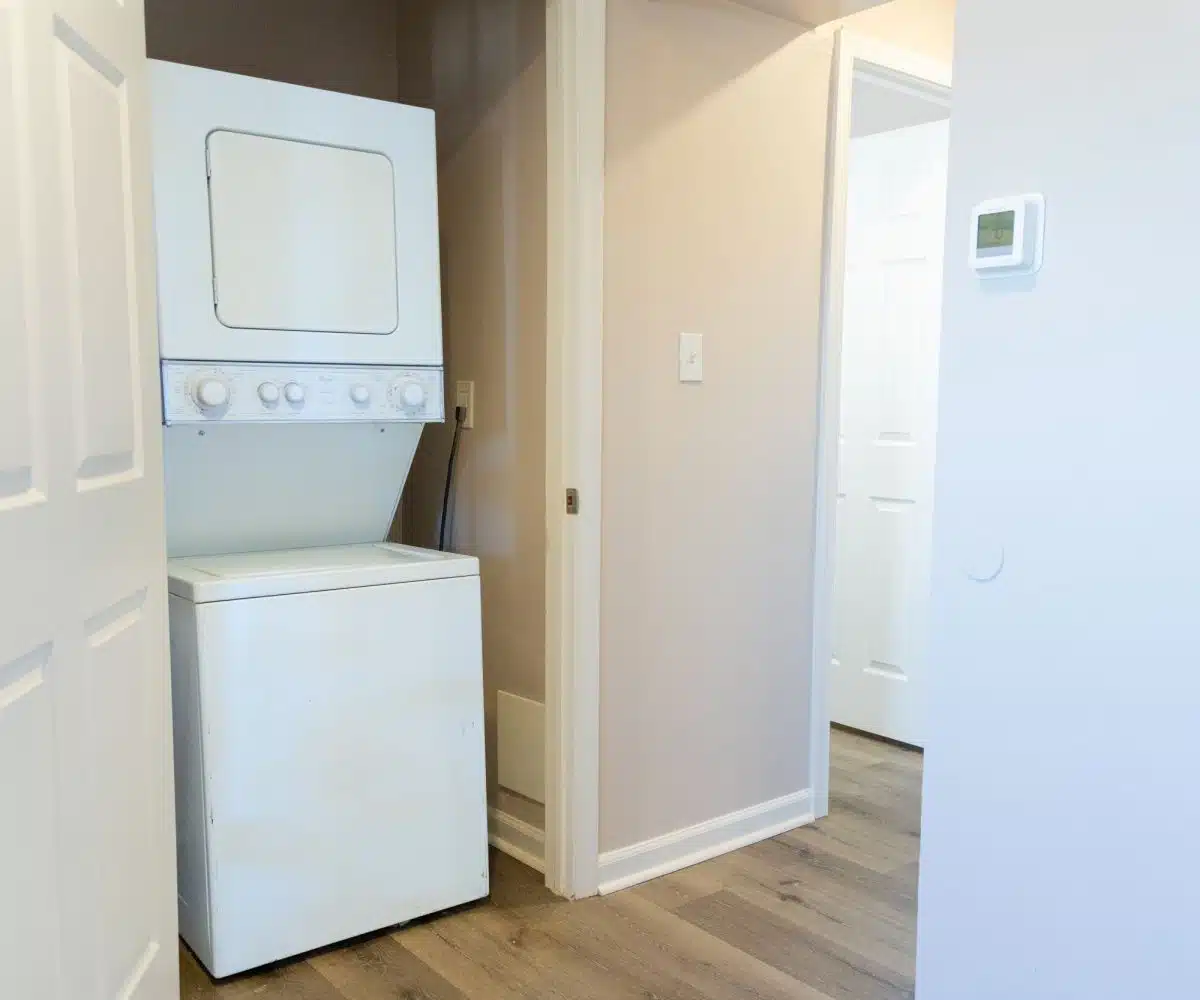 Washer and dryer in hallway closet.