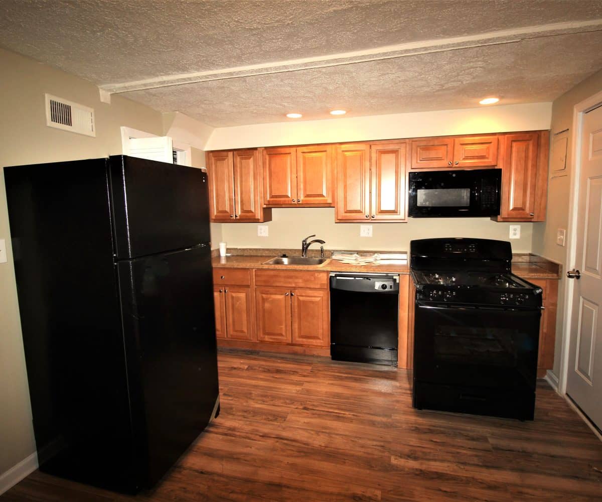 Kitchen with black stainless steel appliances.