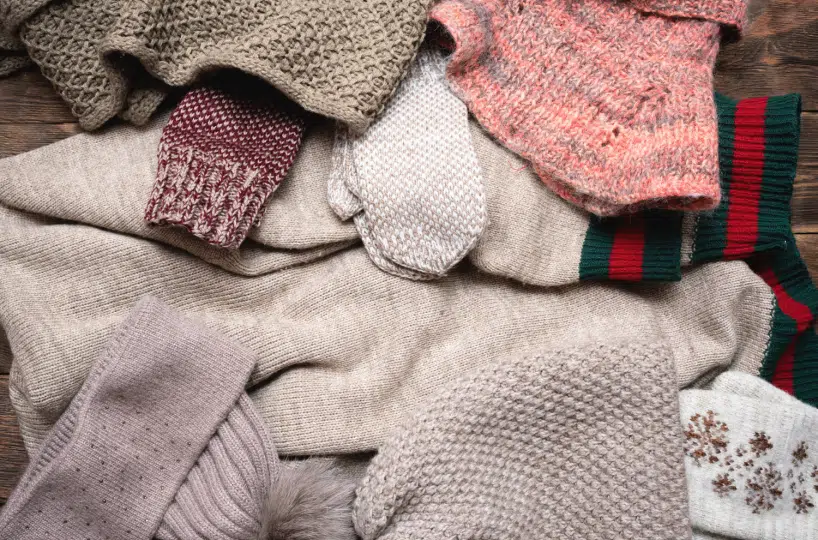 Donating warm clothing in the winter.