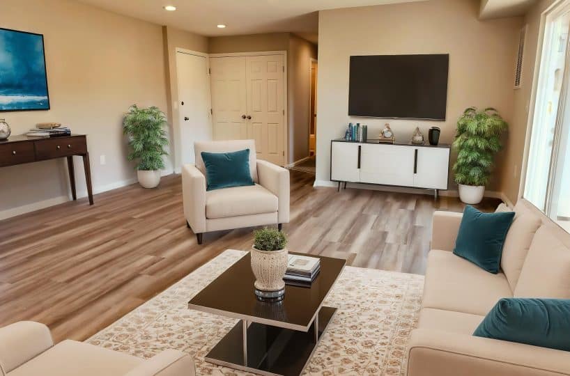 Canterbury house living room with TV, chair and coffee table.