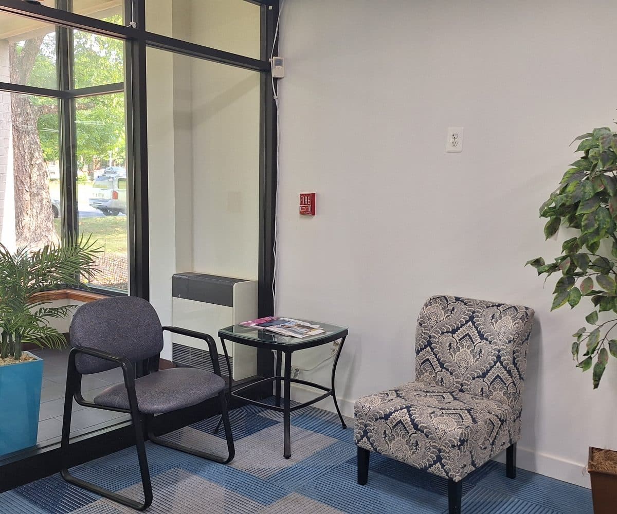 Office entrance with two chairs and a small table.
