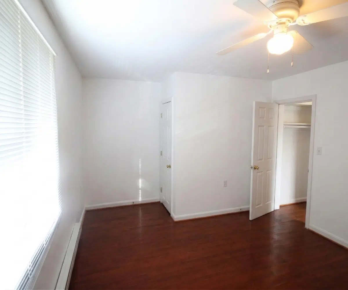 Bedroom with hardwood floors.
